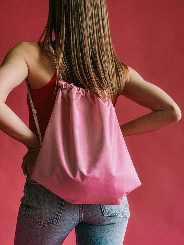 Pink drawstring backpack made of water-repellent fabric - lightweight and durable bag for gym, city use, or everyday wear